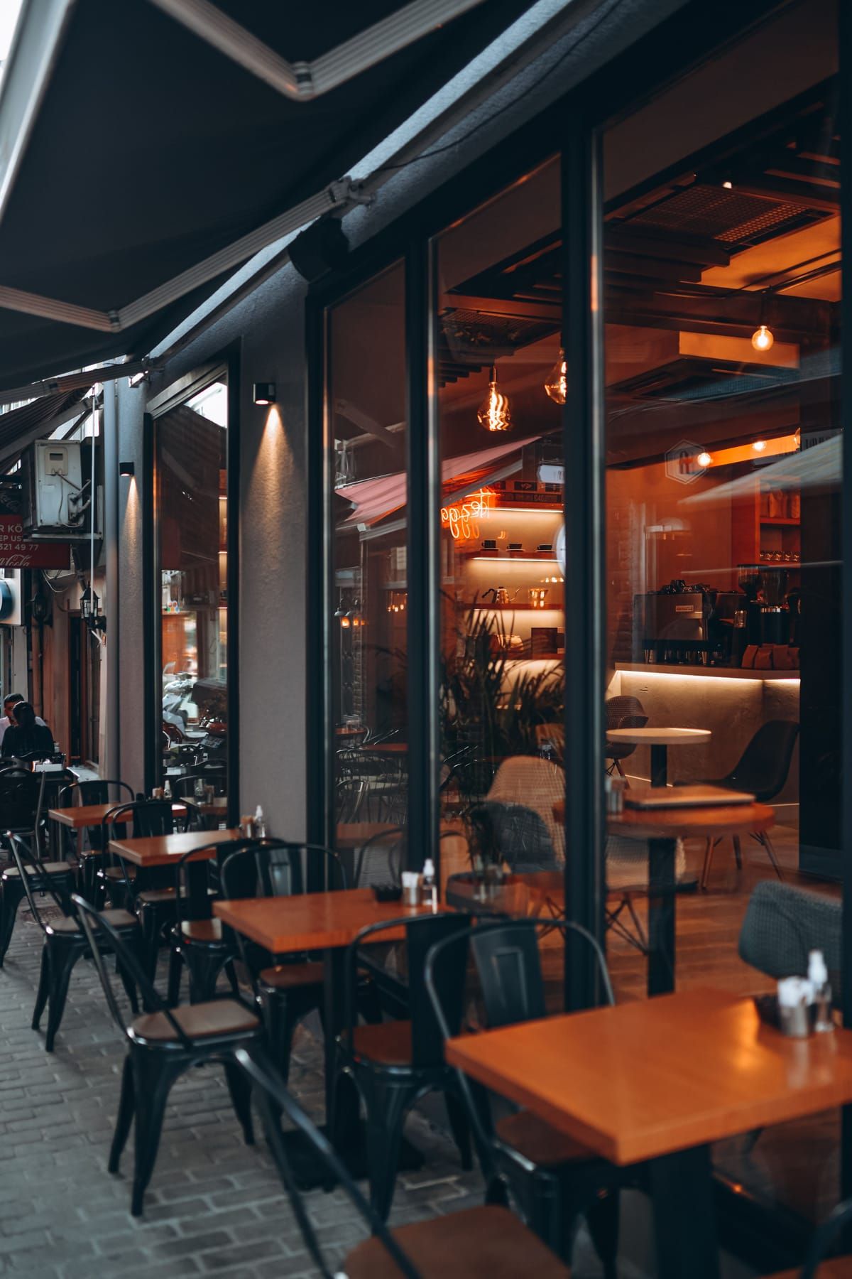 Restaurant dining area with layered lighting and comfortable seating