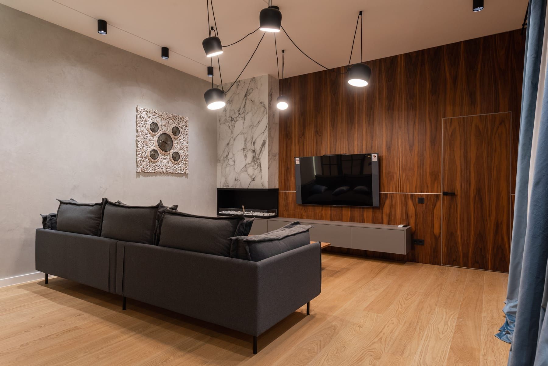 Tone-on-tone textured wall with earth-inspired finishes and statement panels