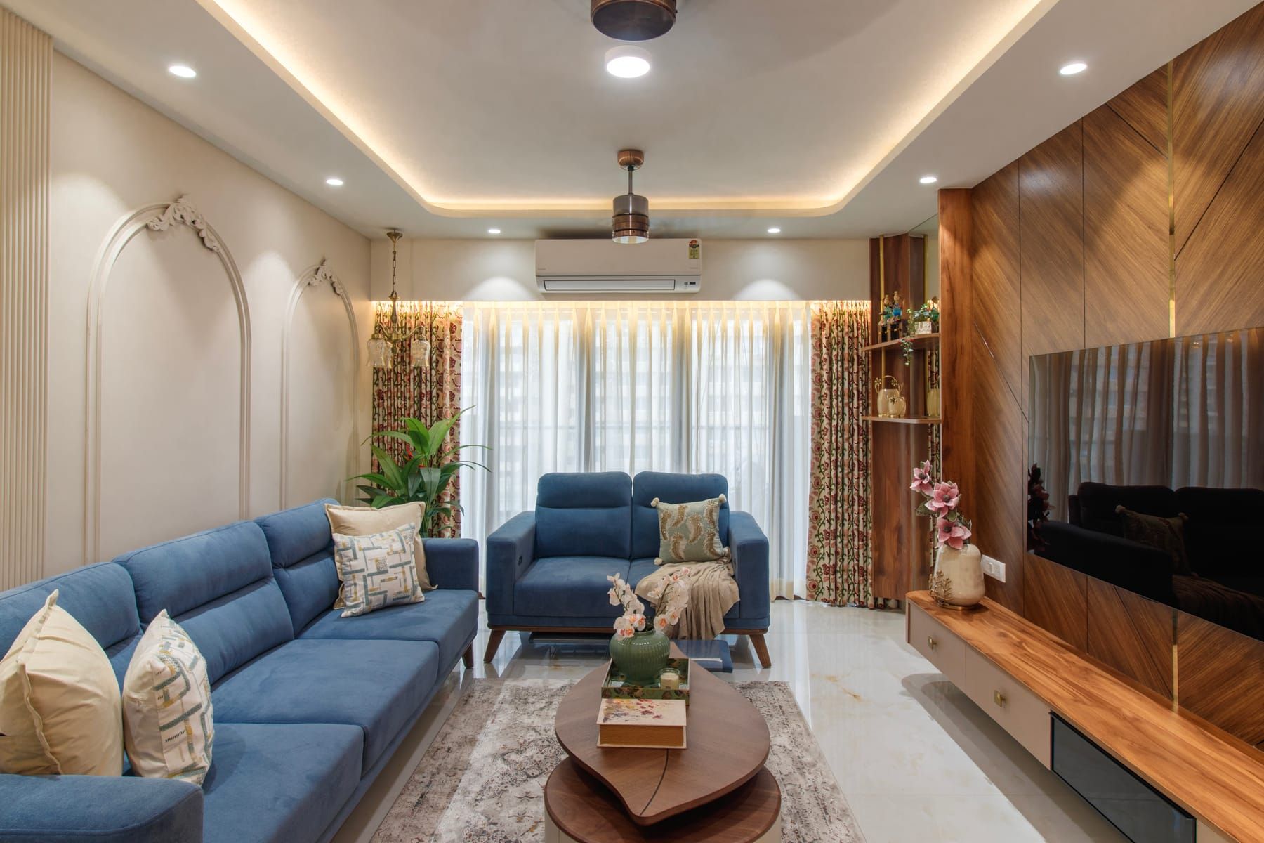 Modern eclectic living room mixing contemporary seating with vintage pieces