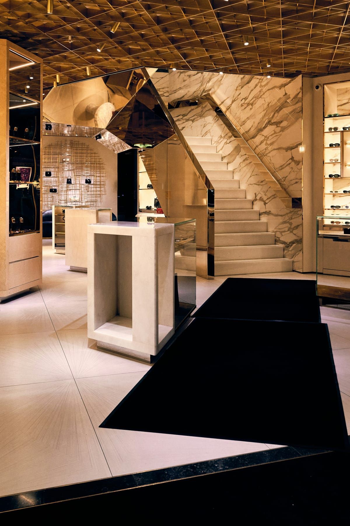 Storefront, fixtures, fitting room and lighting elements included in a SpazioLiv retail interior