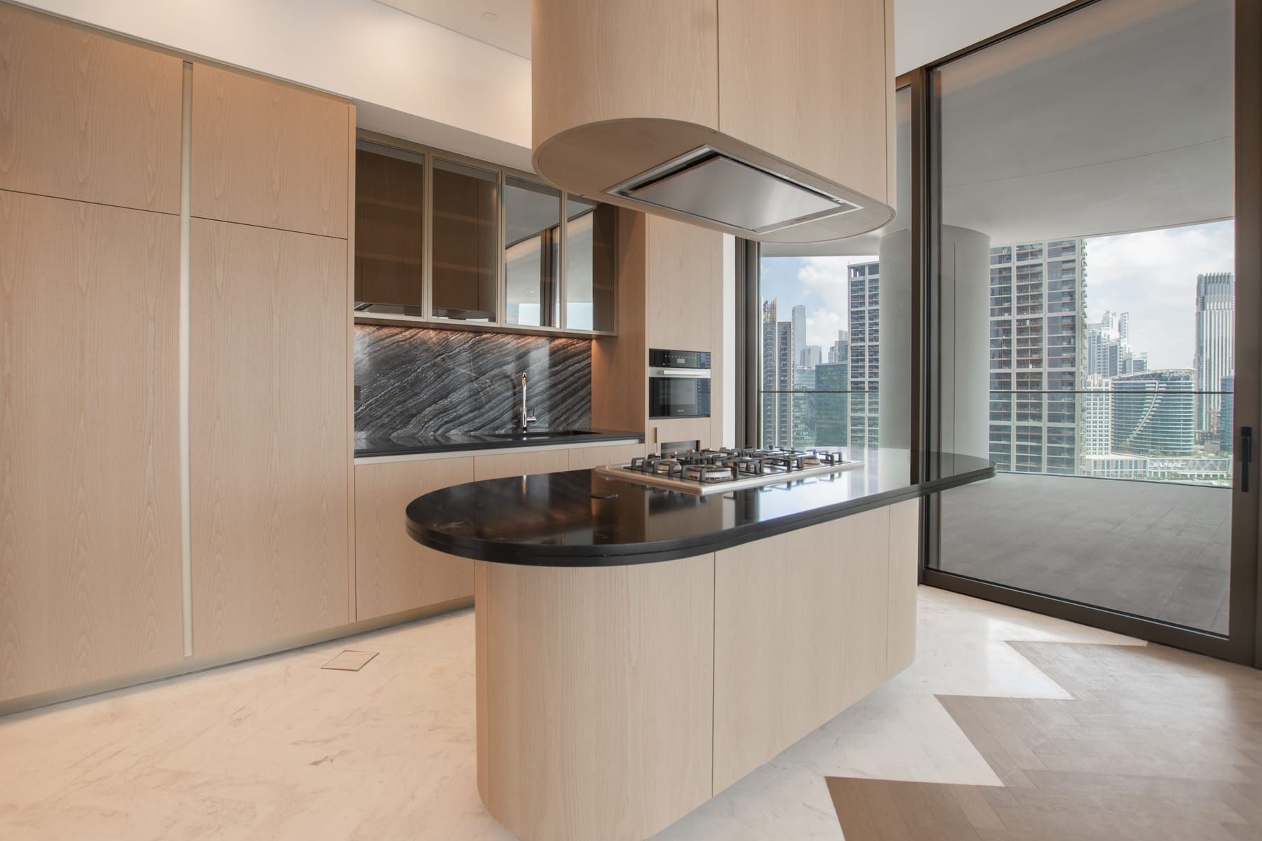 Elements included in a SpazioLiv penthouse interior: living room, modular kitchen and wardrobes