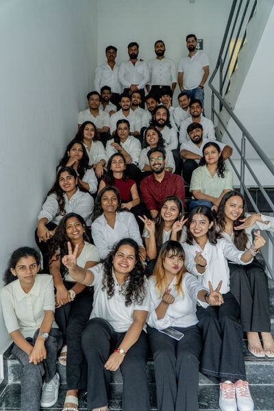 The SpazioLiv team group photo on the staircase